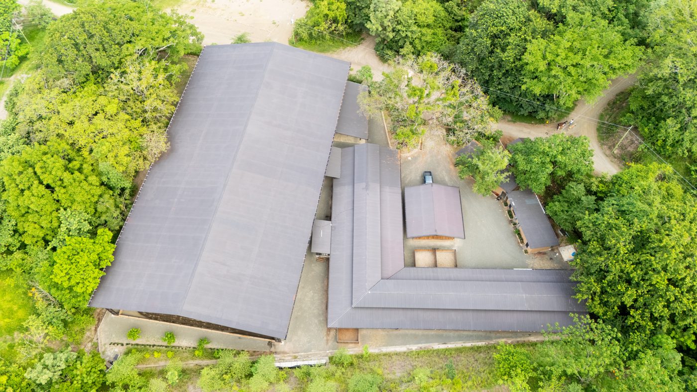 Aerial view of the covered arena, stables and paddocks